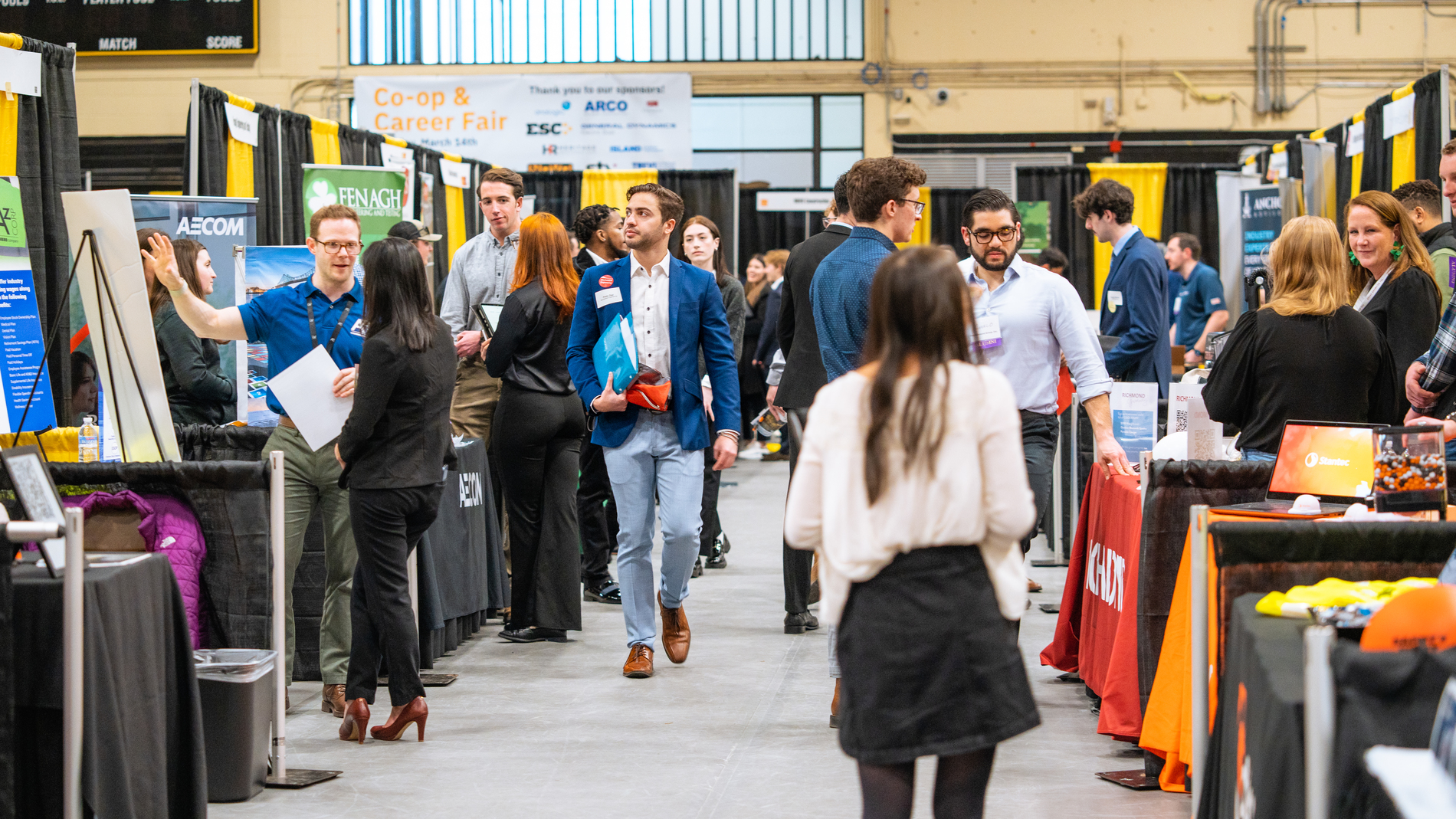 Students and employers talking at the career and co-op fair in 2023