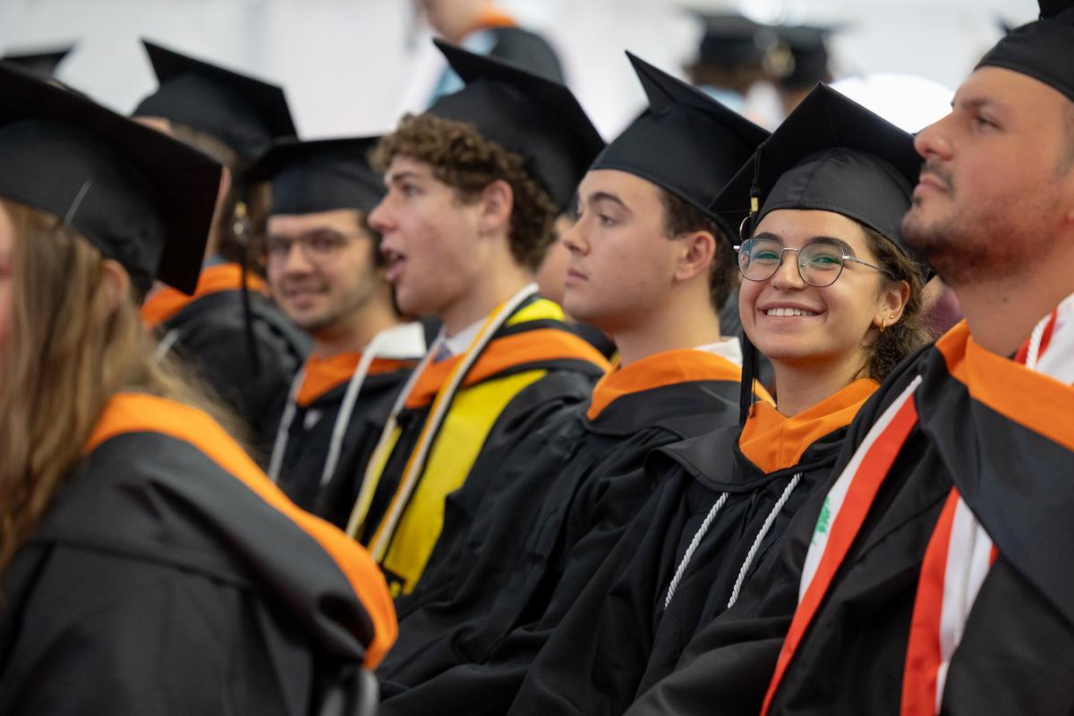 Group of graduating students in their caps and gowns.