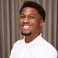 A headshot of Jaquoi
