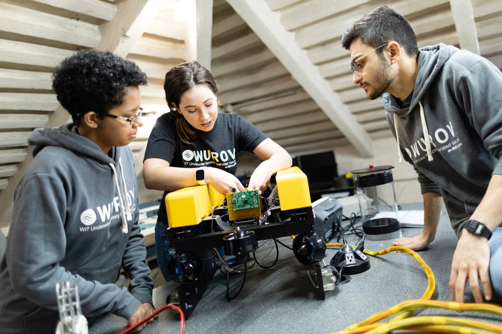 students working on robot