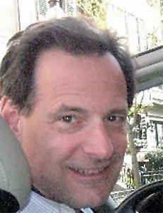 A headshot of a man