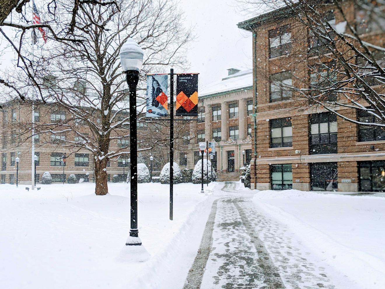 buildings and walkways blanketed by snow
