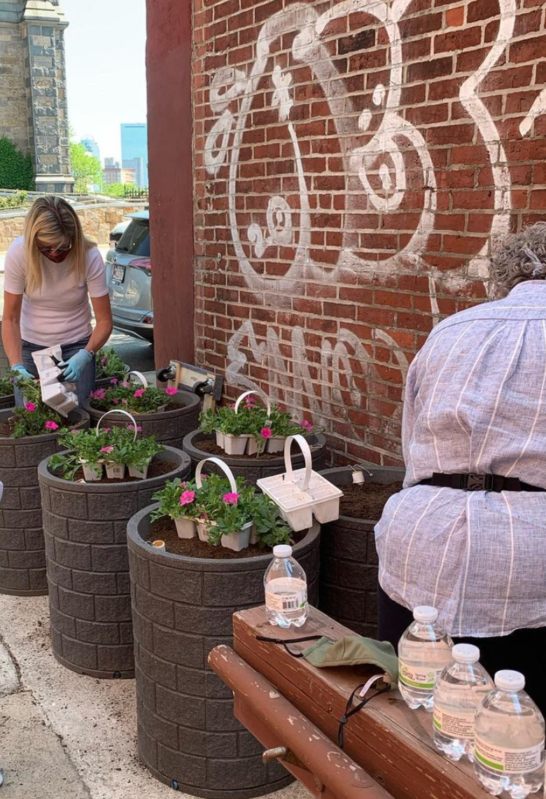 people planting flowers