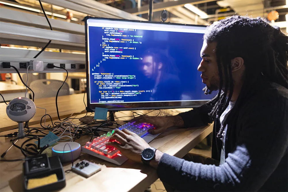 Student coding on a computer