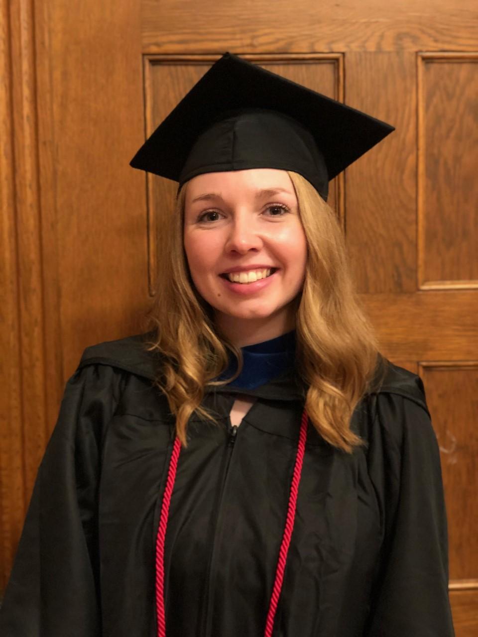 woman wearing graduation cap and gown