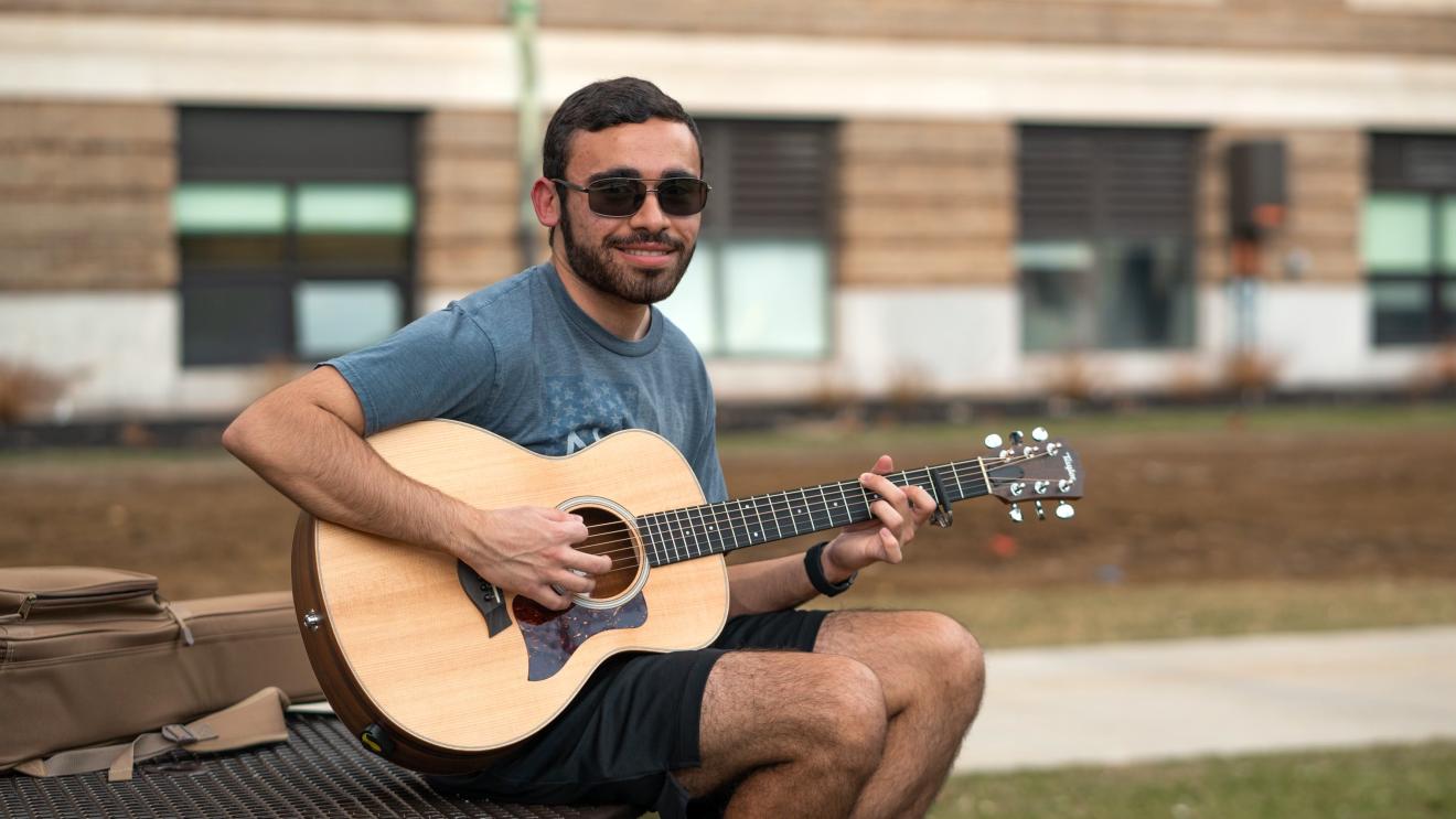 man playing a guitar