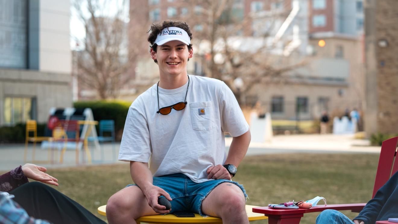 man sitting on a table outside