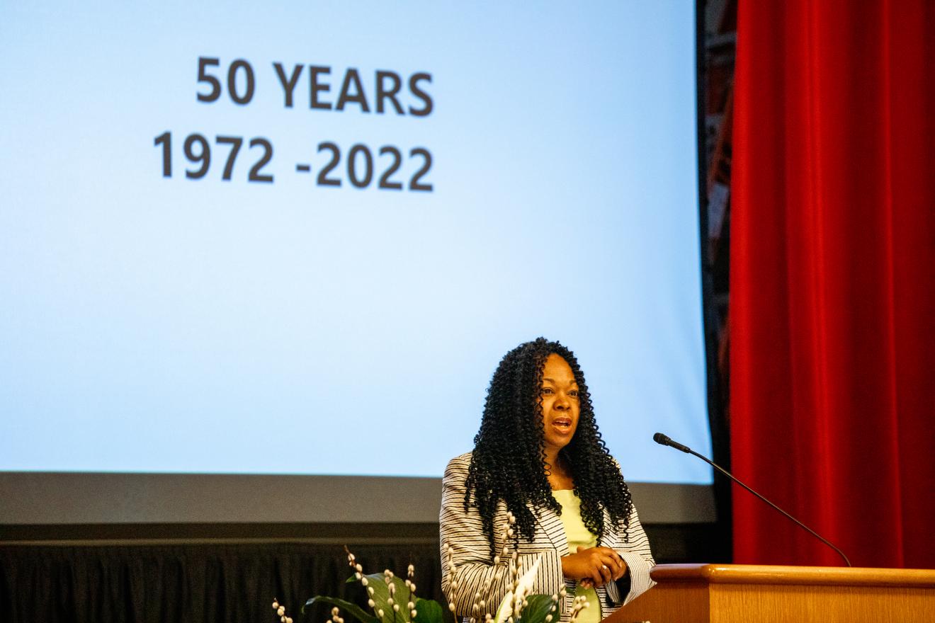 woman speaking at a podium