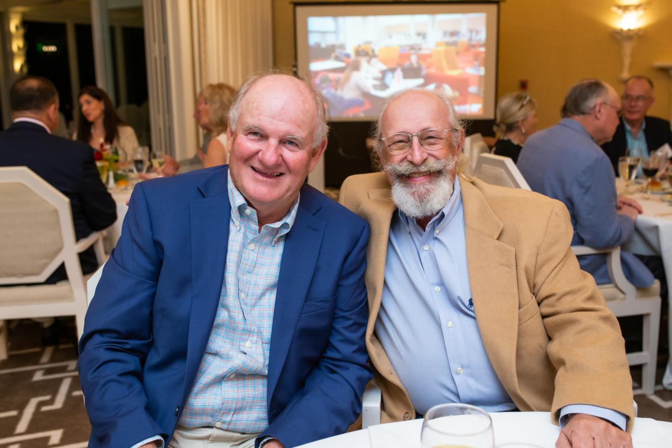 two men sitting at a table