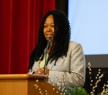 woman speaking into a microphone