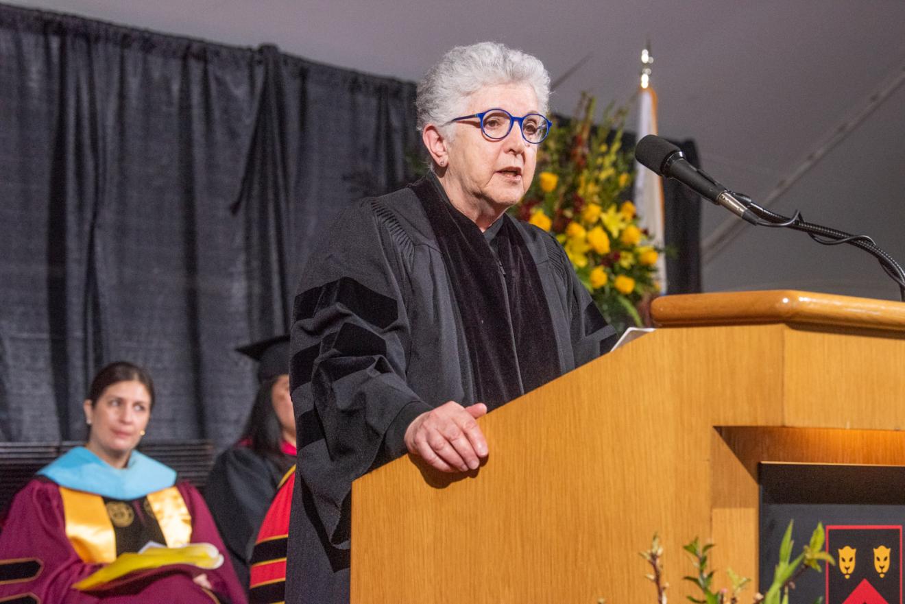 woman speaking at a podium