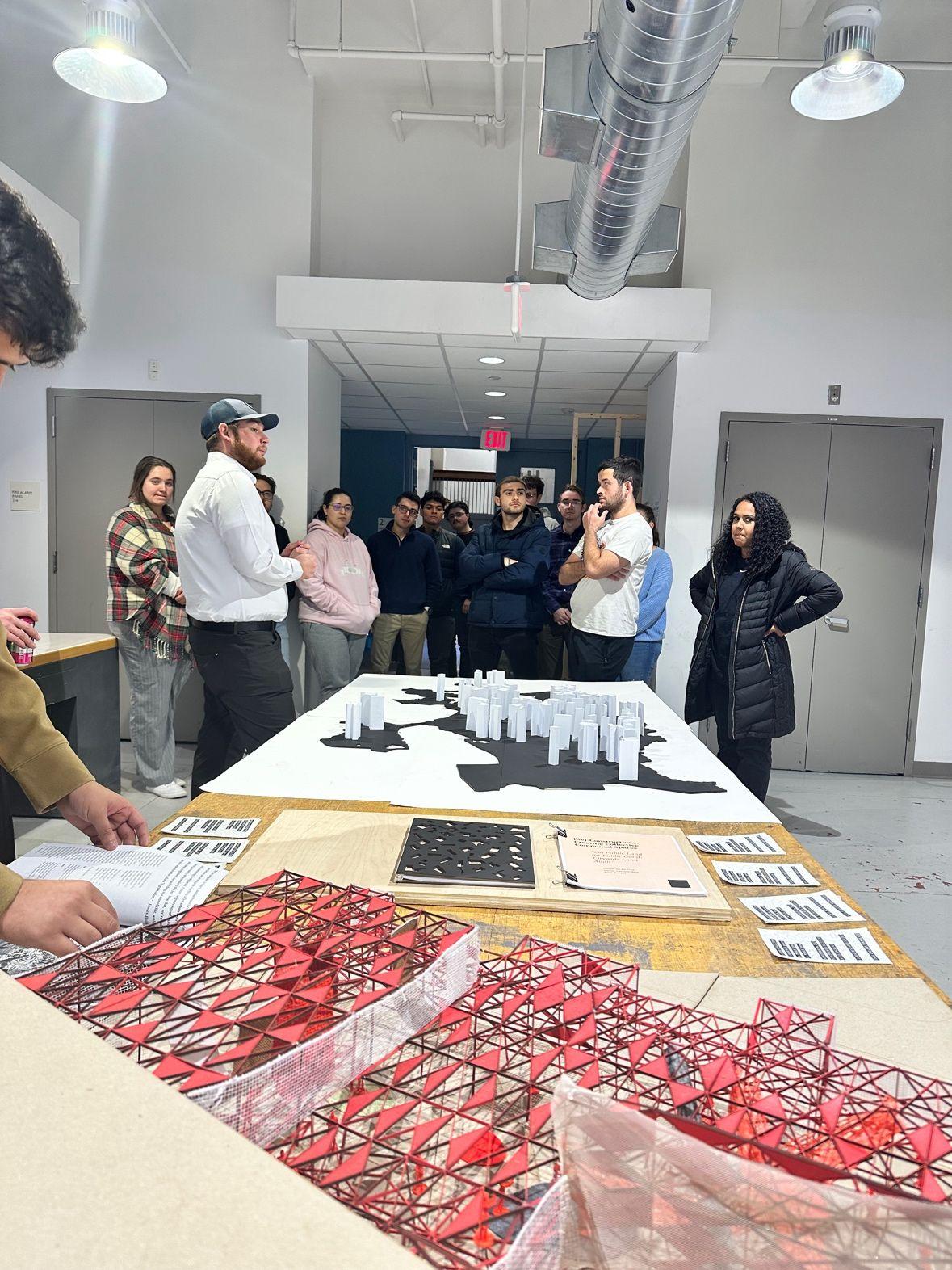 students looking at architectural models