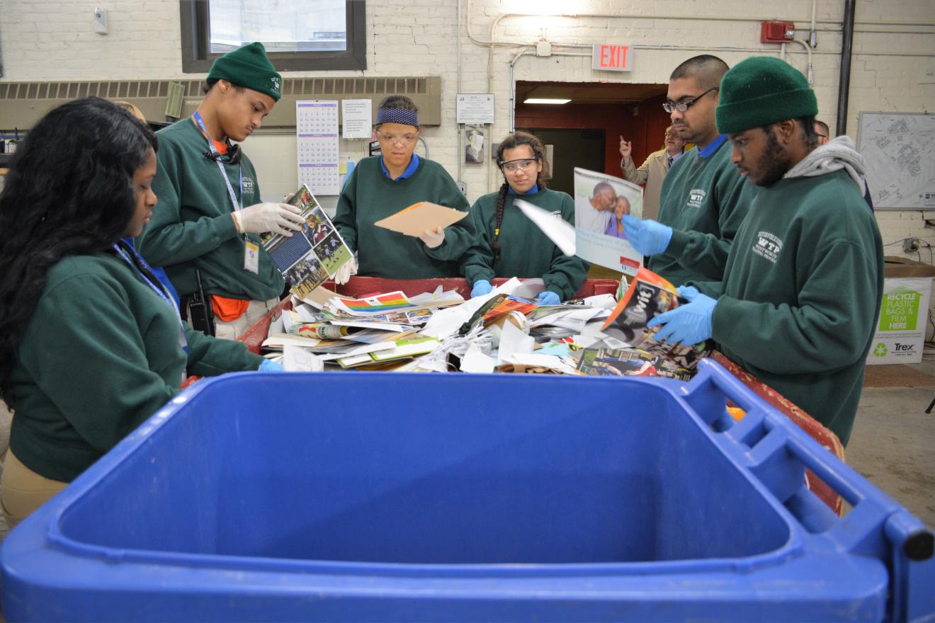 students working in a recycling center