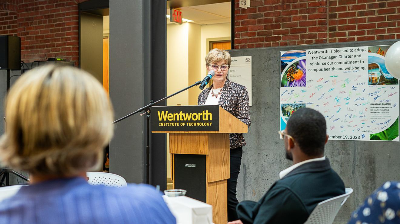 woman speaking at a podium