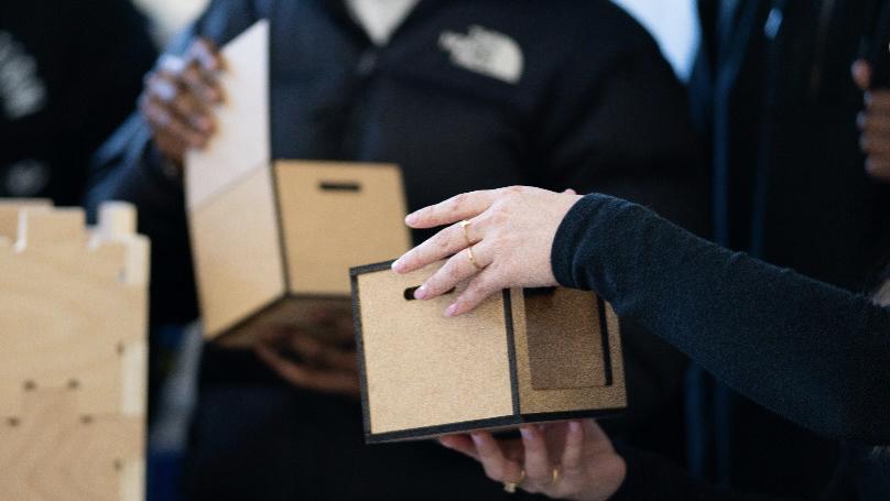 a hand holding a box