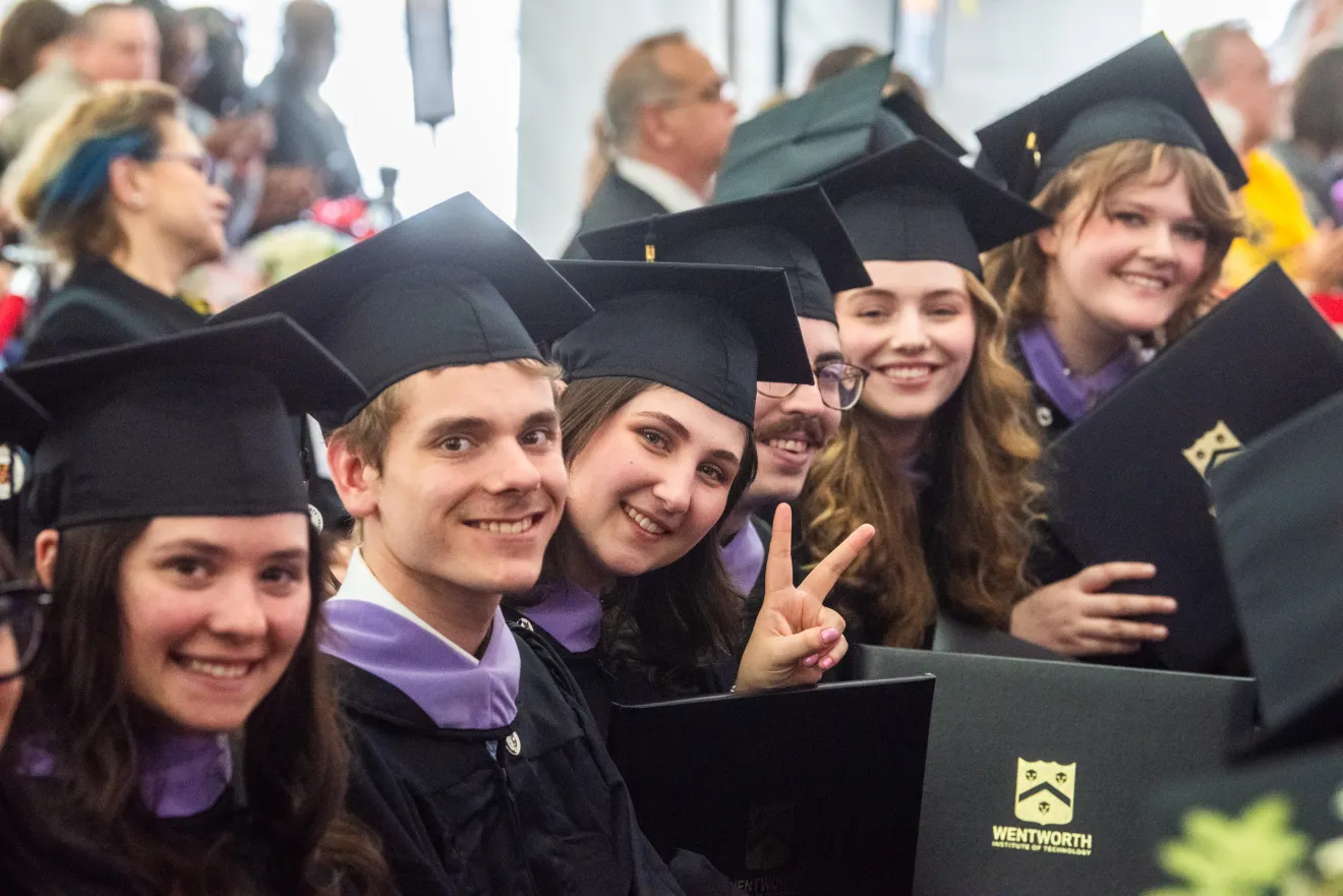 students wearing graduation robes
