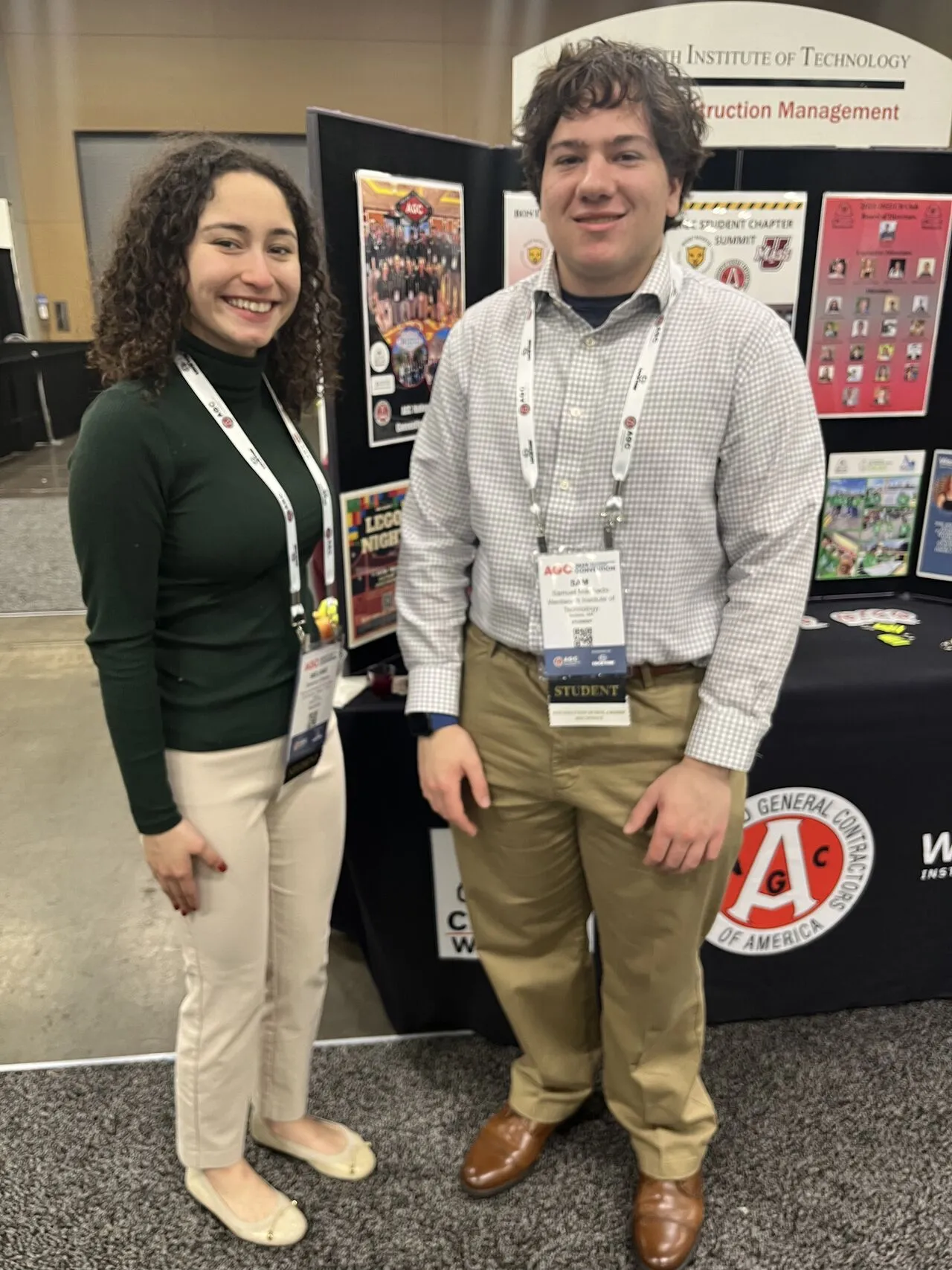 two people posing at a conference