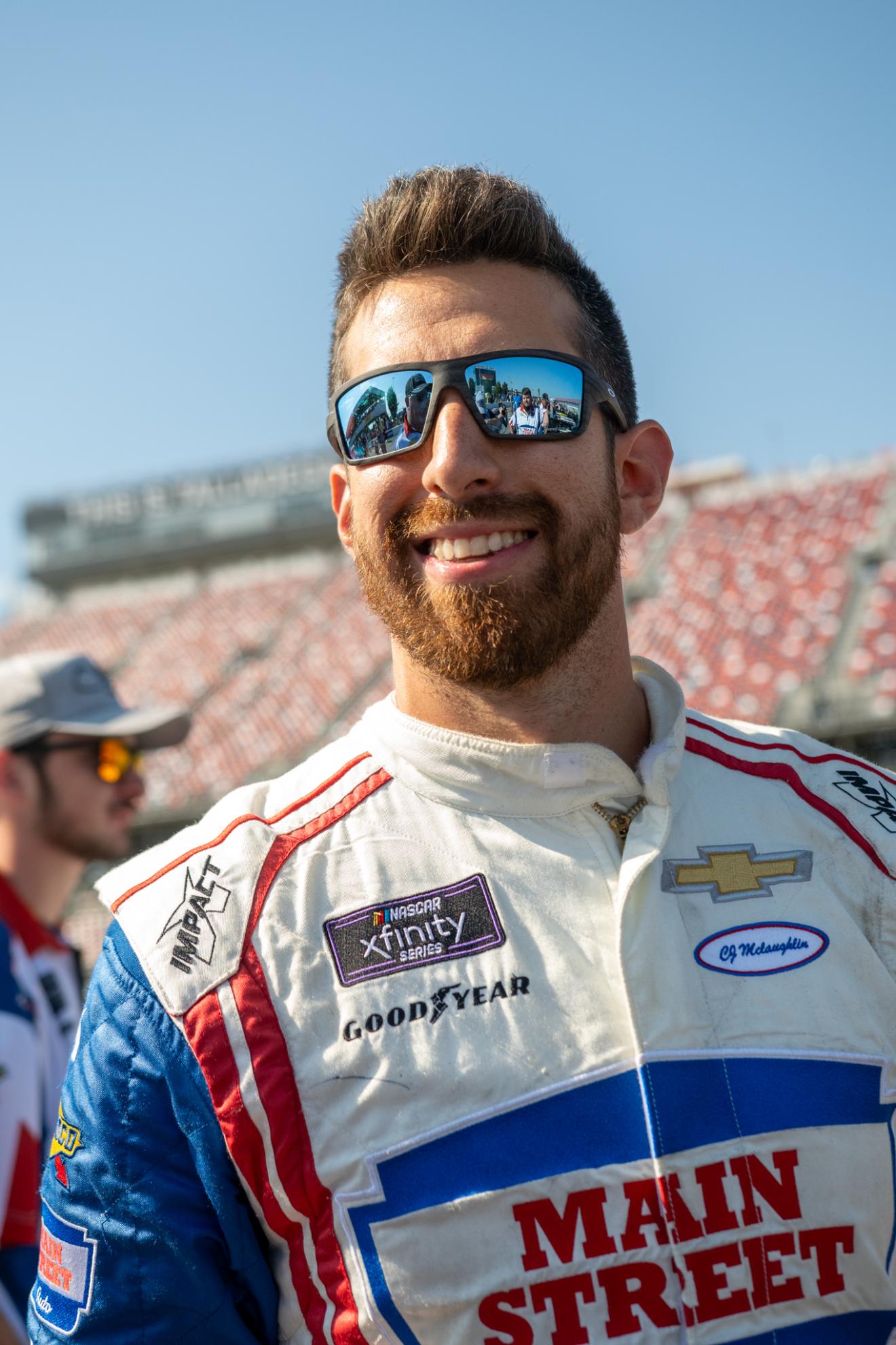portrait of a man in a racing outfit