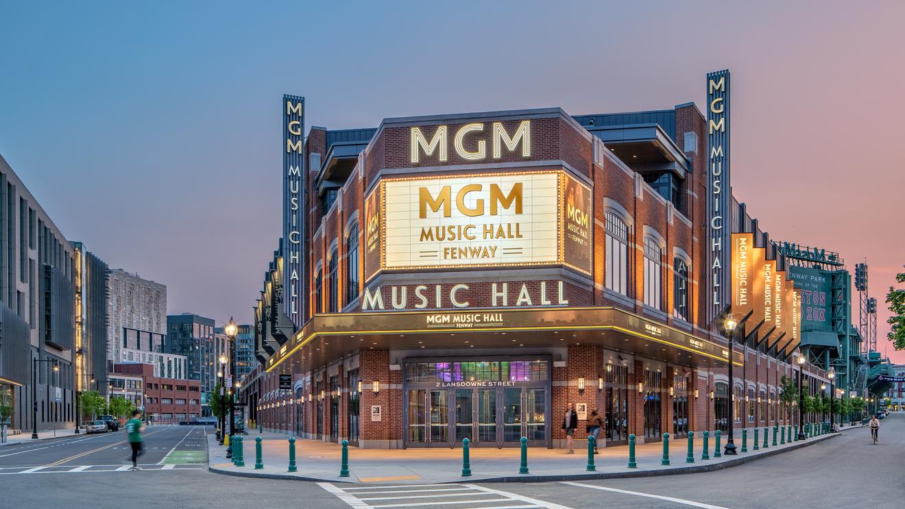 View of the front of the music hall venue featuring the marquee and the street view with a crosswalk in front of the sidewalk.