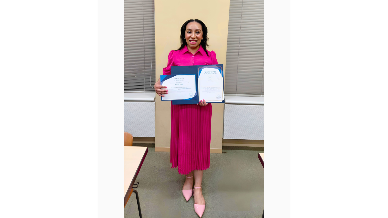 a woman in a red dress holds up an award