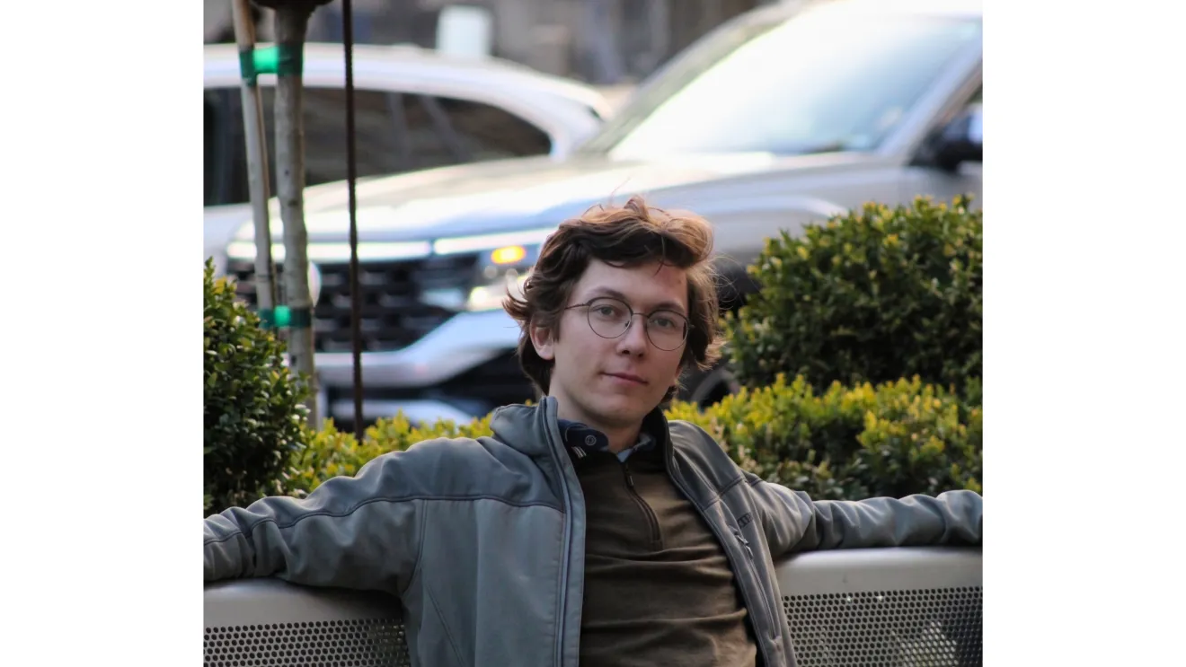 a man sitting on a bench