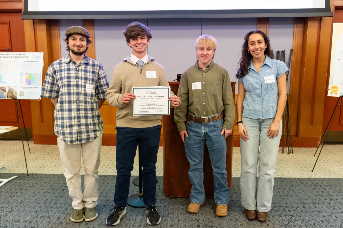 students standing in front of a poster