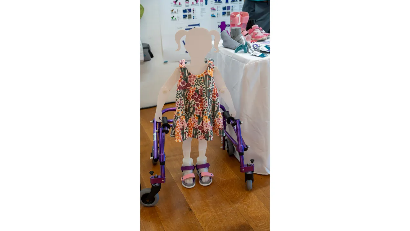 a cardboard cutout of a person wearing shoes