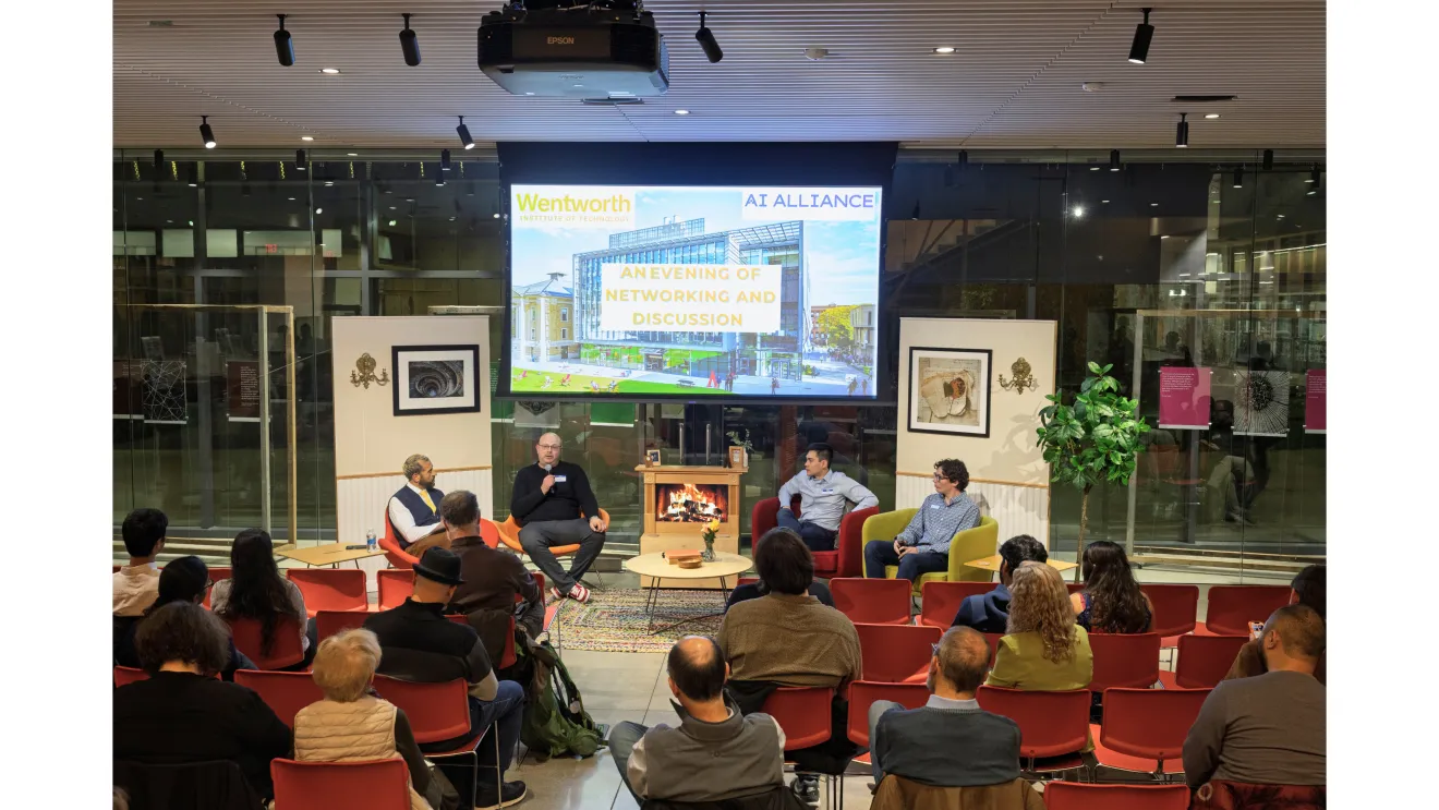 people gathered for an indoor panel discussion