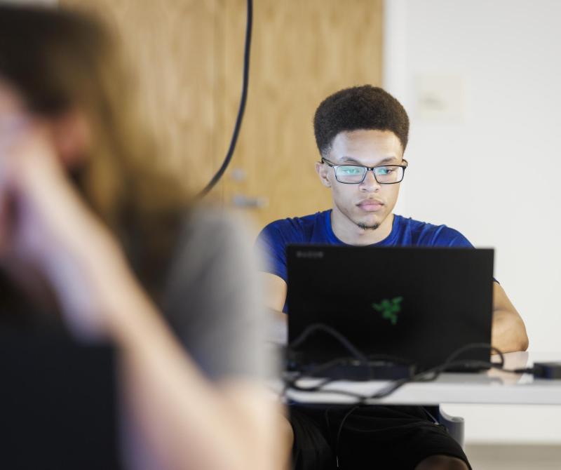 A student works on his laptops in one of the Wentworth high-tech computer labs