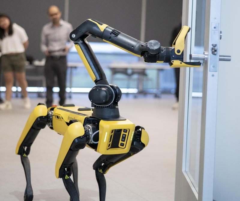 boston dynamics robot opening a door