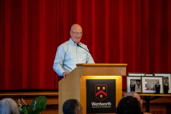 a man speaking at a podium