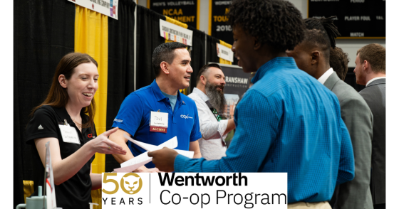 people at a career fair greet one another with smiles