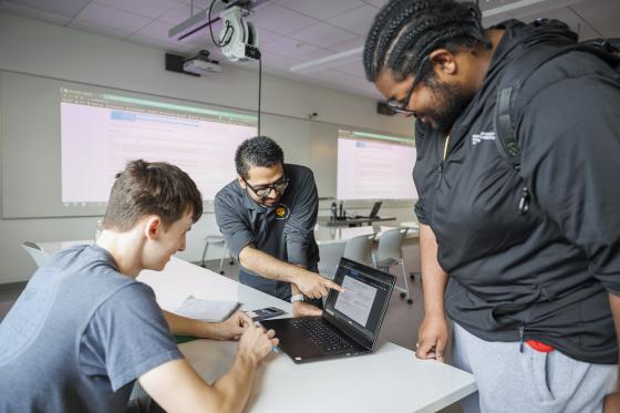 a group of students working on computers