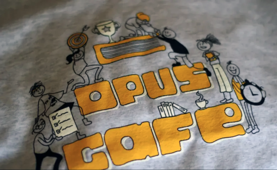 a t-shirt with the words "opus cafe"