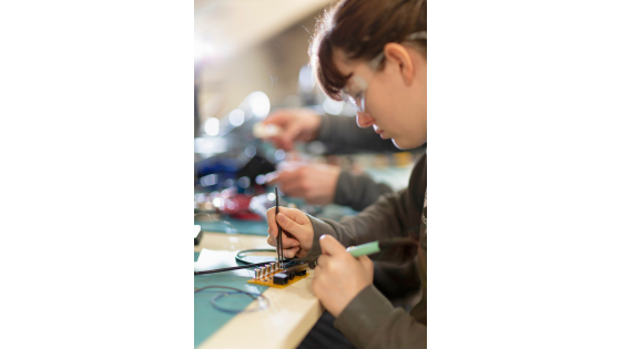 a woman working on a computer engineering project