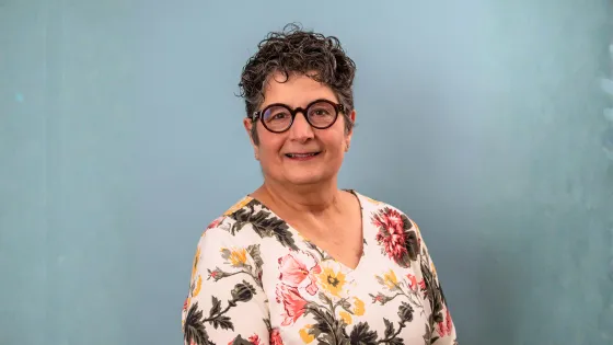 portrait of a woman with a blue background