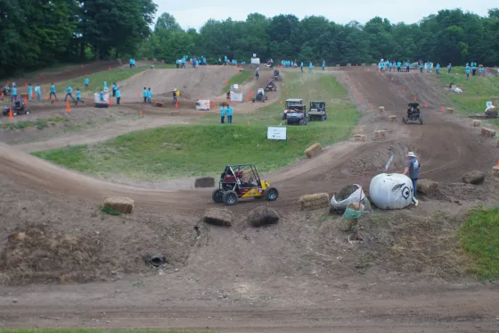 a dirt track featuring a buggy racing vehicle