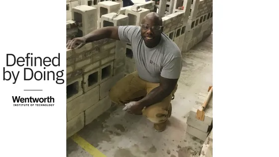 a man squats near concrete