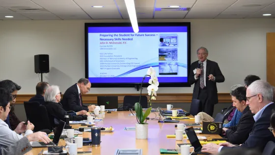 a group of people in a conference room
