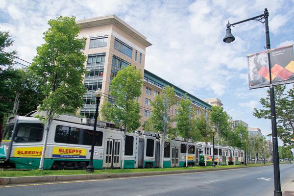 Green line train passing in front of Wentworth.