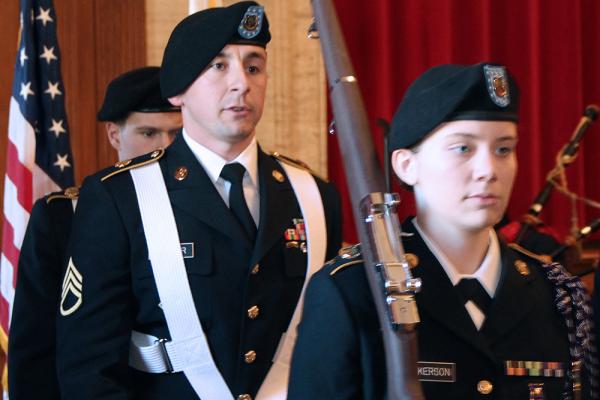 Students in uniform celebrating Veterans' Day.