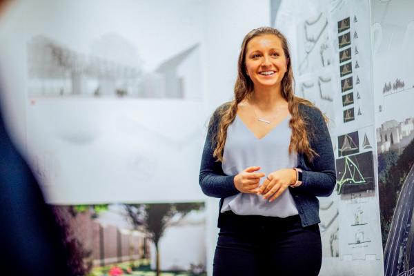 A female architecture student presents her project for final review