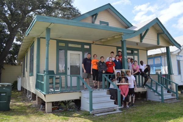 ASB 2014 participants posing in front of their completed project, a renovated home in Houston.