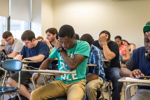 Dual Enrollment students learn in a classroom.