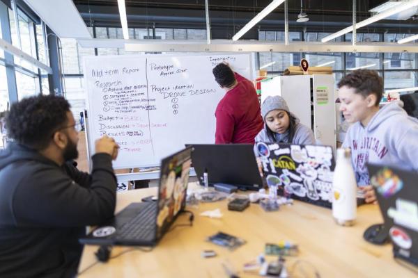 Students at a whiteboard