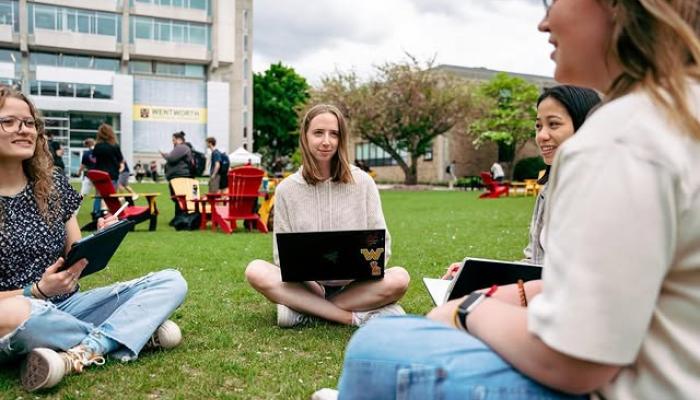 Using a laptop for a group project on the Quad
