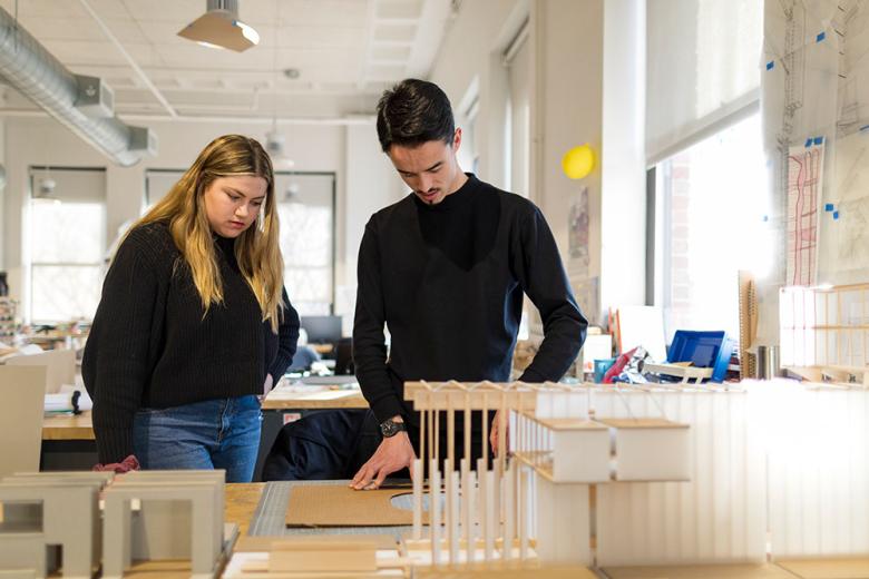 Two students standing in Arch Studios