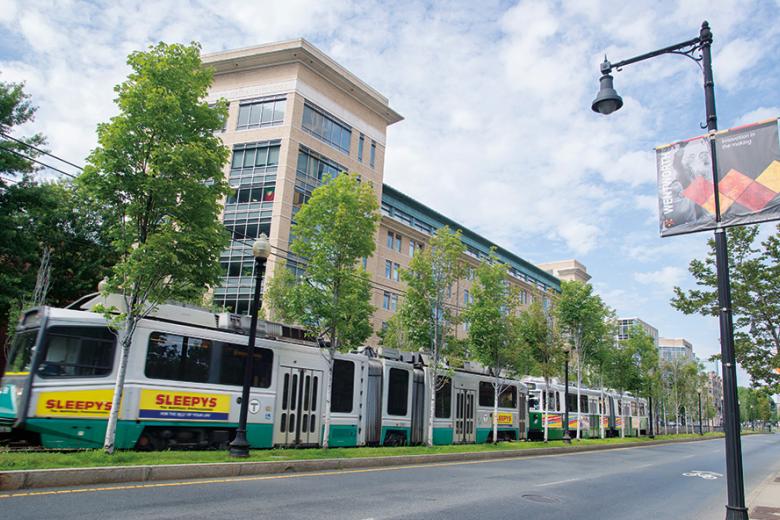 Green line train passing in front of Wentworth.