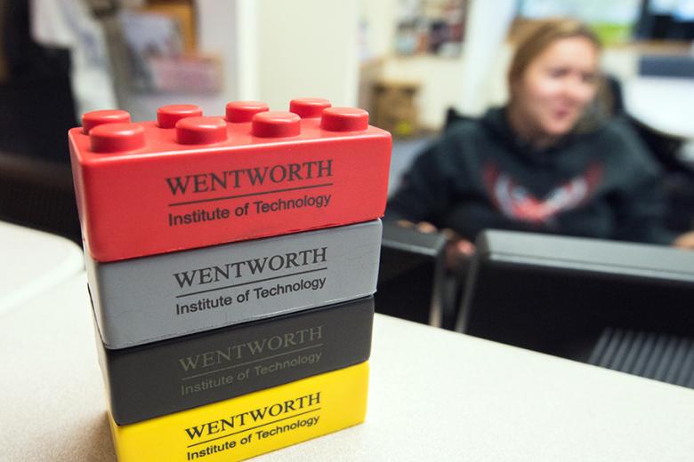 A stack of lego building blocks, branded with Wentworth's logo.