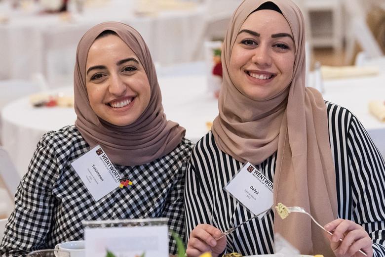 Two women in hijabs attend a Wentworth event.